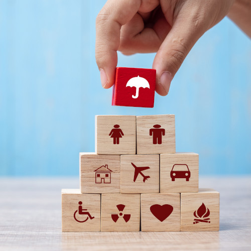 Hand holding umbrella wood block cover Insurance icon. healthcare